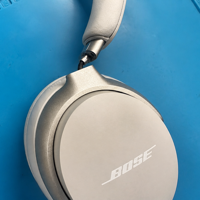 Bose QuietComfort Ultra headphone hinge broken showing exposed joint damage